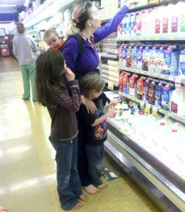 Mother and children in a grocery store