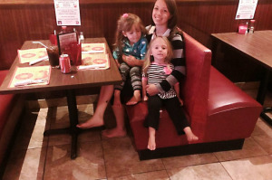 Woman-sitting-with-children-in-a-restaurantsharpbright